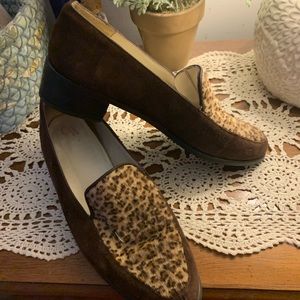 CW leather leopard shoes made in Spain .